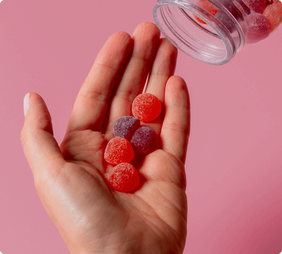 Hand holding Keto Spark gummies, keto-friendly supplement for energy and appetite support